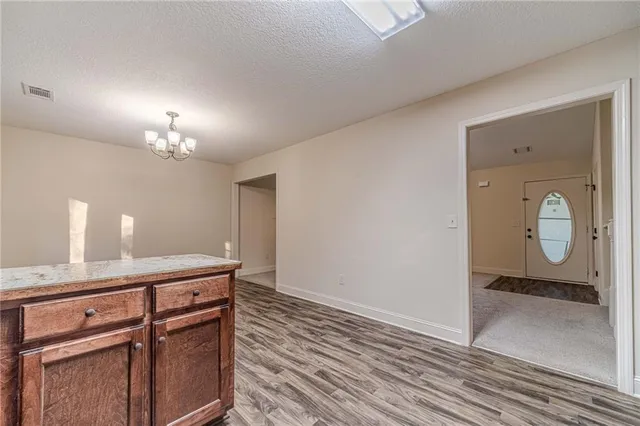 a room with a mirror and a sink