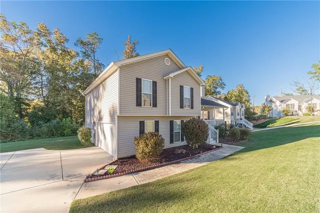 a front view of a house with a yard