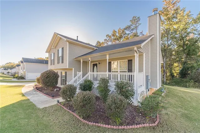 a front view of a house with garden