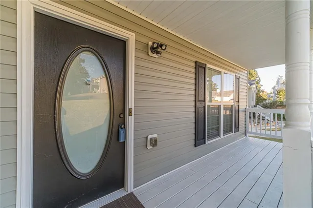 a view of a livingroom with wooden floor and glass door