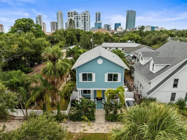 a aerial view of a house with a yard and plants