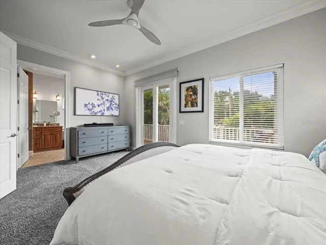 a spacious bedroom with a large bed and a window