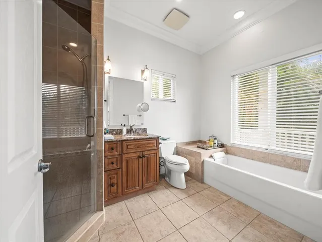 a bathroom with a granite countertop toilet a sink and bathtub