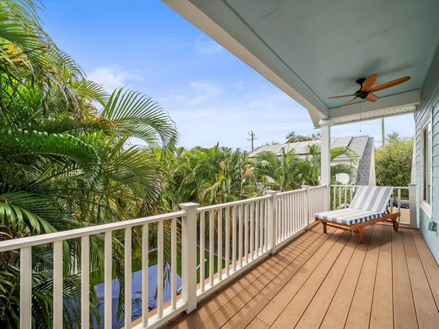a view of a balcony with chairs