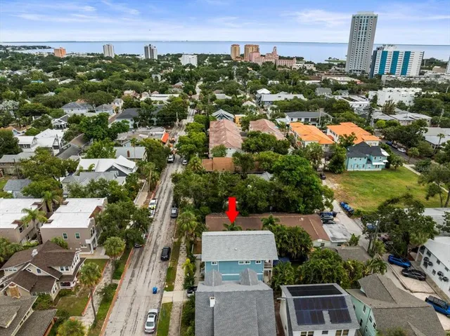 an aerial view of residential houses with outdoor space