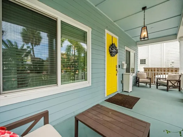 a view of a chairs and table in patio