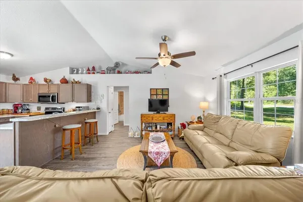 a living room with furniture and a large window