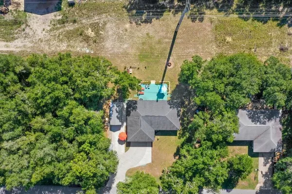 an aerial view of a house with a lake view