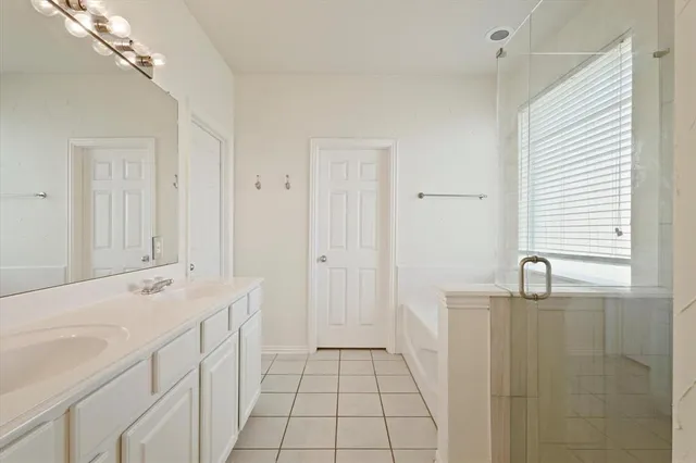 a bathroom with a sink a vanity and a mirror