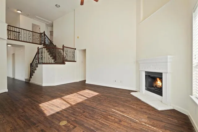a view of a room with wooden floor and staircase