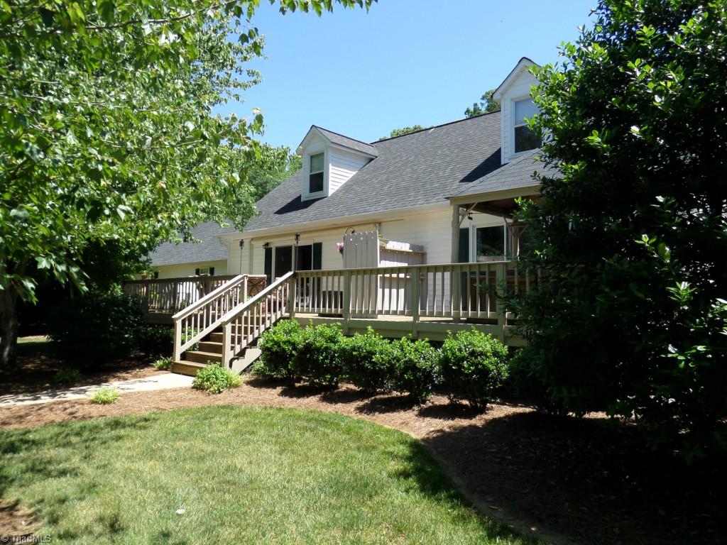 1880 Beckner Road Lexington, NC 27292 - Photo 21 of 30 This is the lake side of the house with the large deck area across the house. There is a retractable awning over the deck area.