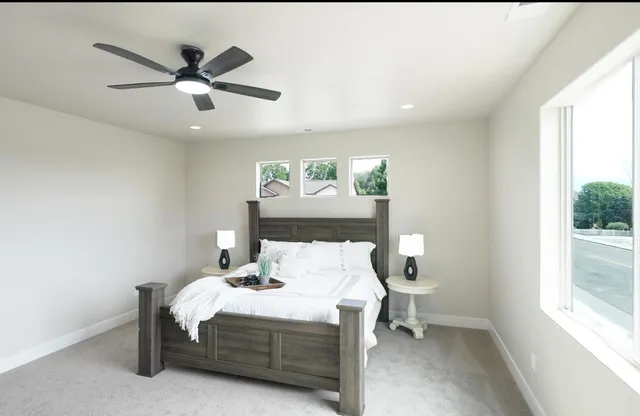 a bedroom with a bed and window