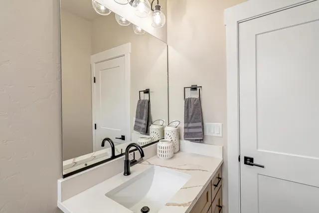 a bathroom with a sink and a mirror