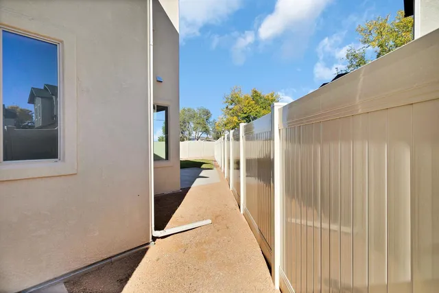 a view of a hallway with a potted plant