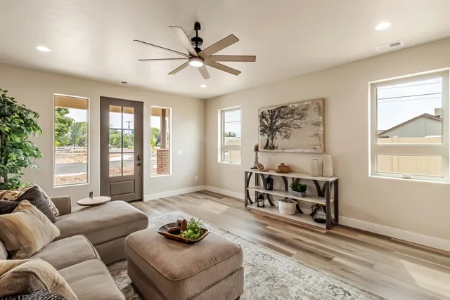a living room with furniture and a large window