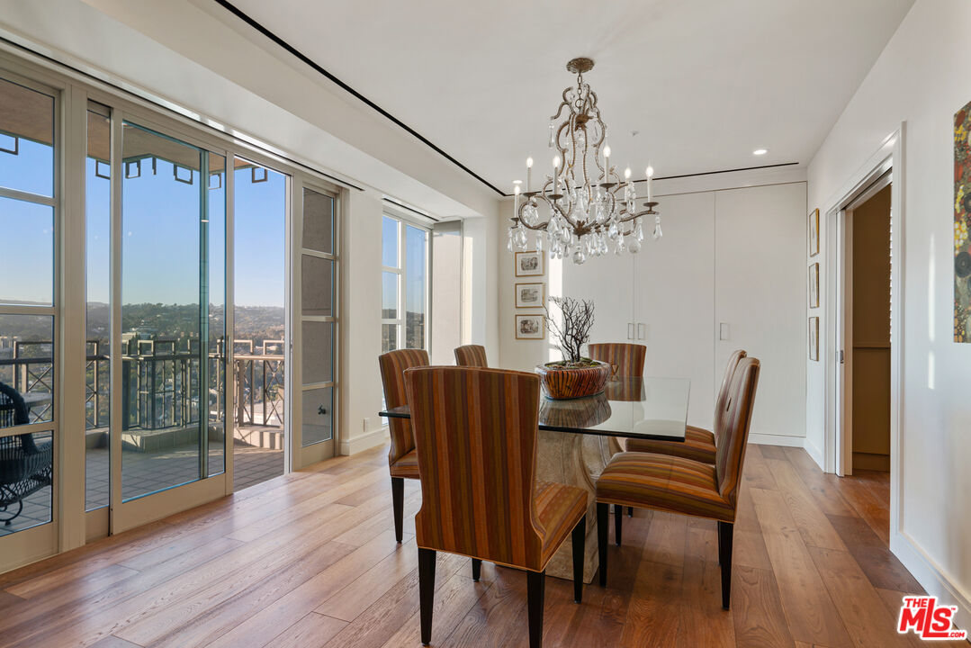 10580 Wilshire Boulevard, Unit 23NE Los Angeles, CA 90024 - Photo 12 of 42 a view of a dining room with furniture window and wooden floor