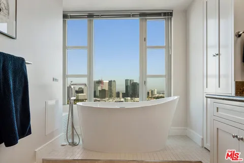 a dining table chair next to a window