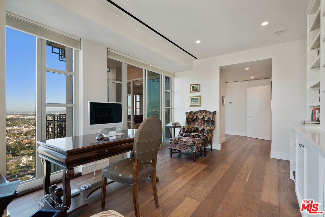 10580 Wilshire Boulevard, Unit 23NE Los Angeles, CA 90024 - Photo 26 of 42 a view of a workspace with furniture and a window
