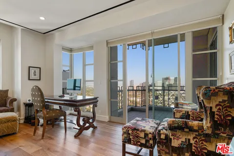 a workspace with furniture and a window
