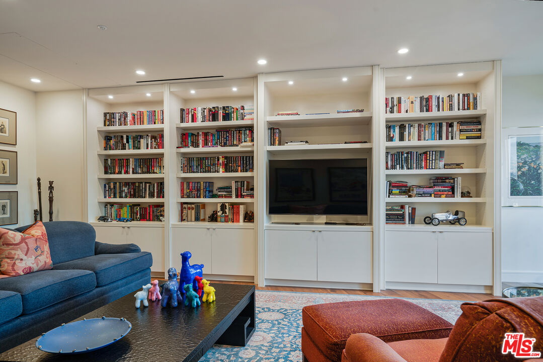 10580 Wilshire Boulevard, Unit 23NE Los Angeles, CA 90024 - Photo 31 of 42 a living room with furniture and a flat screen tv