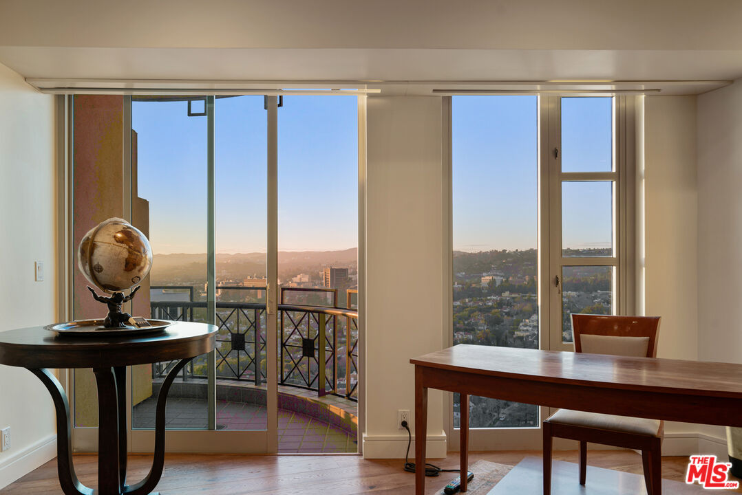 10580 Wilshire Boulevard, Unit 23NE Los Angeles, CA 90024 - Photo 32 of 42 a view of a workspace with furniture and a window