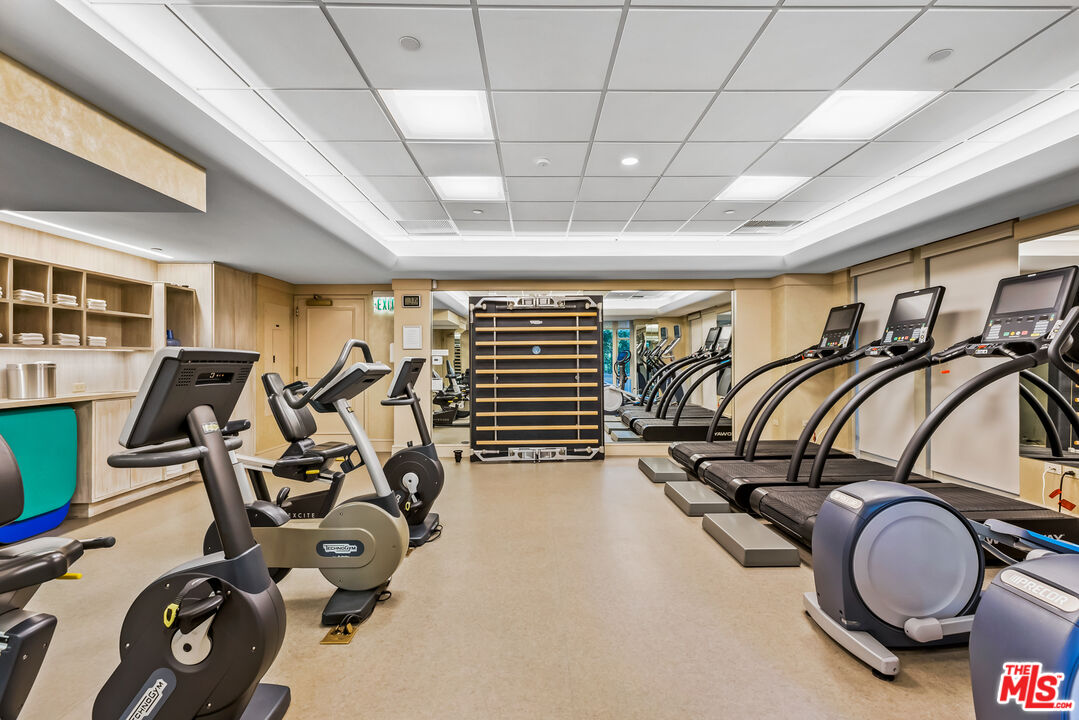 10580 Wilshire Boulevard, Unit 23NE Los Angeles, CA 90024 - Photo 38 of 42 a view of a room with gym equipment