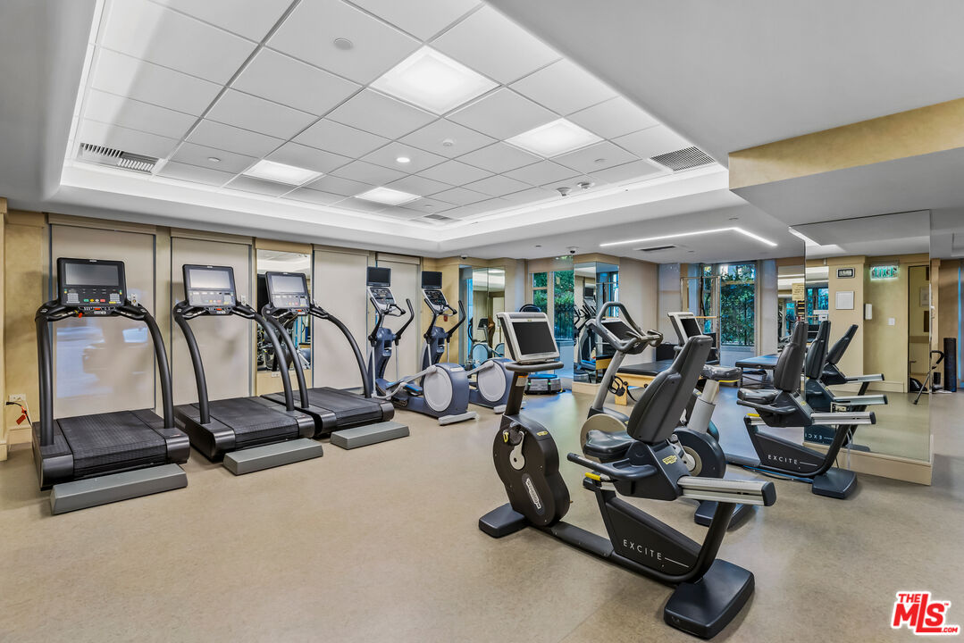 10580 Wilshire Boulevard, Unit 23NE Los Angeles, CA 90024 - Photo 39 of 42 a view of a room with gym equipment