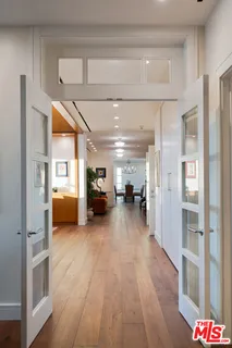 a view of a hallway view with wooden floor and furniture