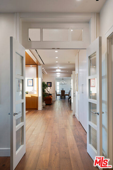 10580 Wilshire Boulevard, Unit 23NE Los Angeles, CA 90024 - Photo 9 of 42 a view of a hallway view with wooden floor and furniture