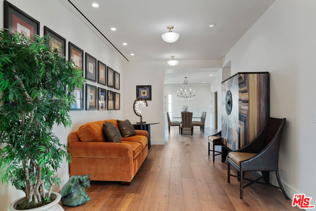 10580 Wilshire Boulevard, Unit 23NE Los Angeles, CA 90024 - Photo 10 of 42 a living room with furniture and a potted plant