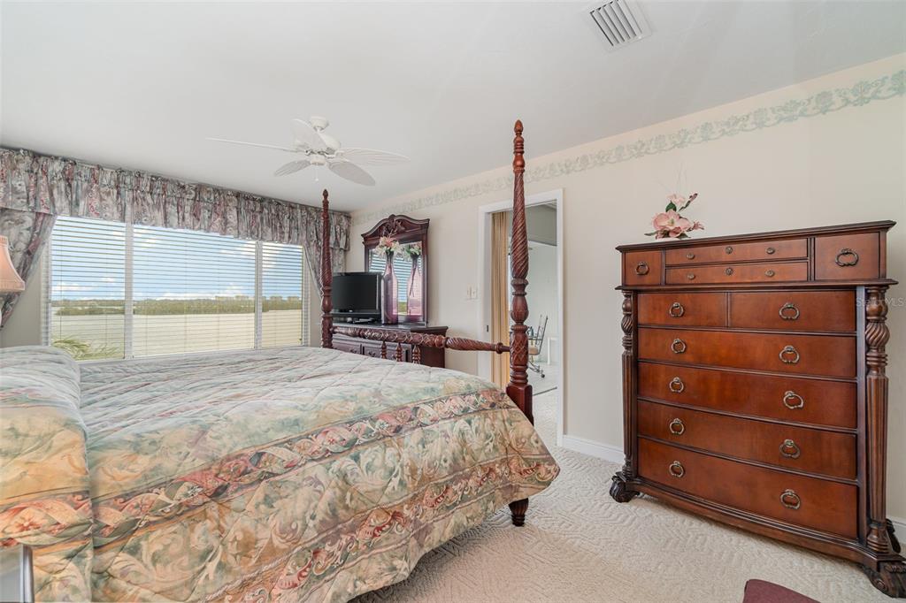 9011 Midnight Pass Road, Unit 329 Sarasota, FL 34242 - Photo 21 of 39 a bedroom with a bed and a window