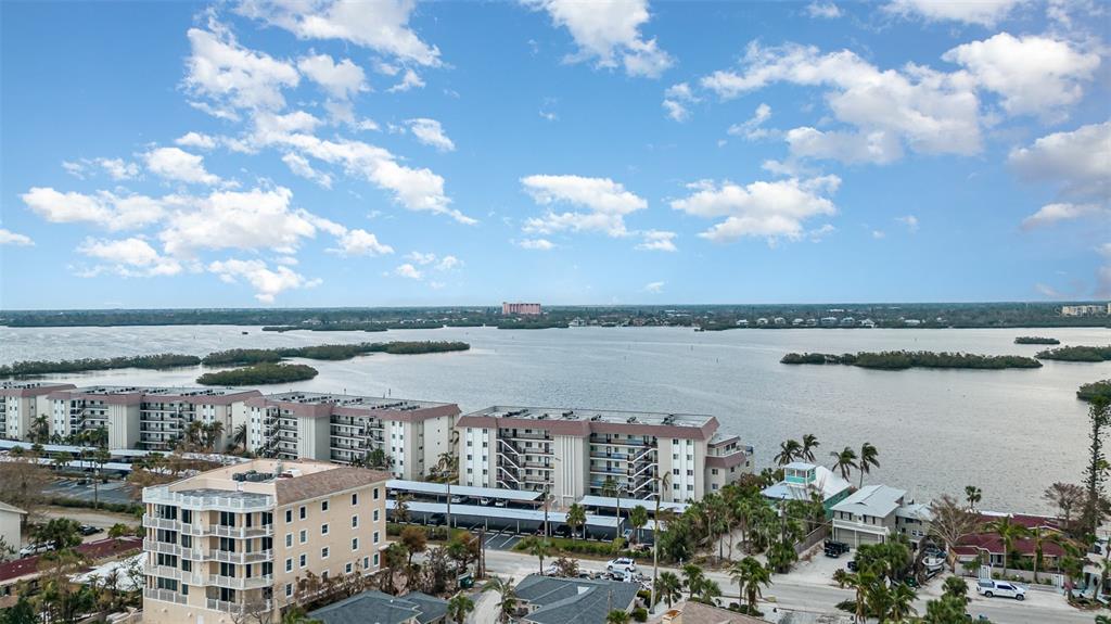 9011 Midnight Pass Road, Unit 329 Sarasota, FL 34242 - Photo 35 of 39 a view of a lake and a city