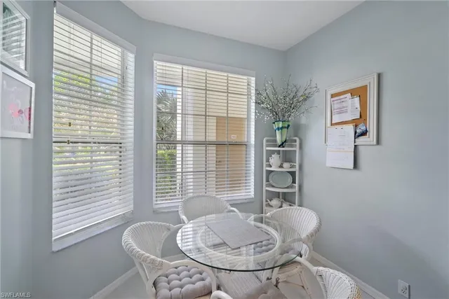 a bathroom with a sink mirror and toilet