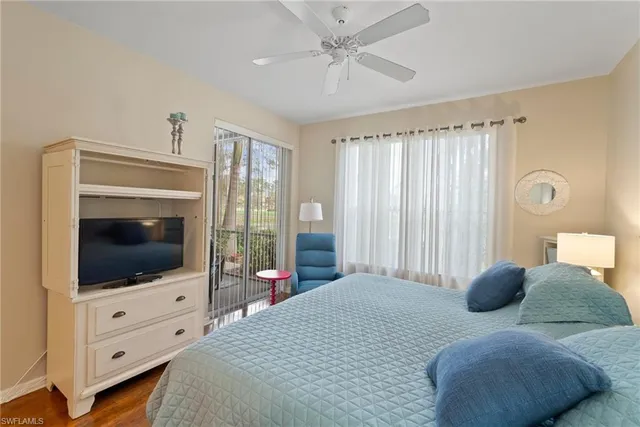 a balcony with furniture and a lake view