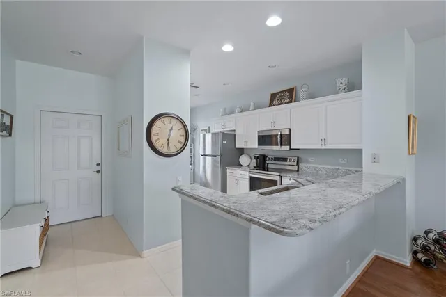 a kitchen with a sink stove and microwave
