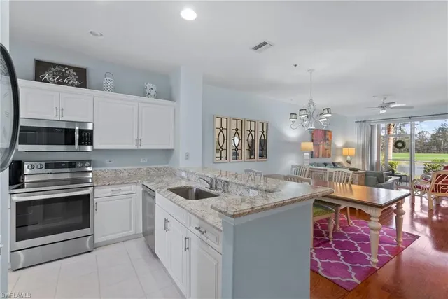 a bed room with a bed and a chair