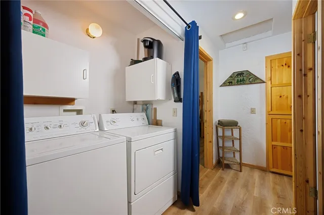 a view of hallway with washer and dryer