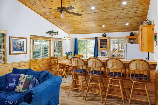 a living room with lots of furniture and a chandelier