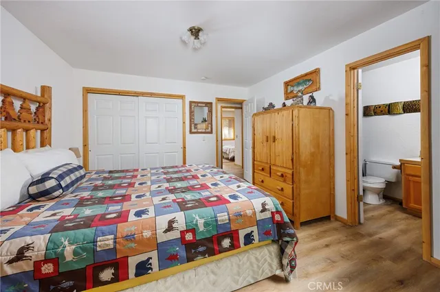 a bedroom with bed and a window