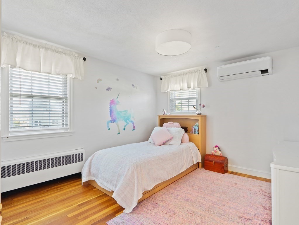 93 Meadowbrook Road Needham, MA 02492 - Photo 19 of 34 a bedroom with a bed and a window