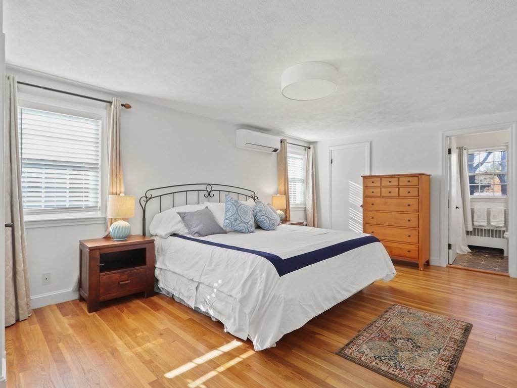 93 Meadowbrook Road Needham, MA 02492 - Photo 23 of 34 a bedroom with a large bed and a window