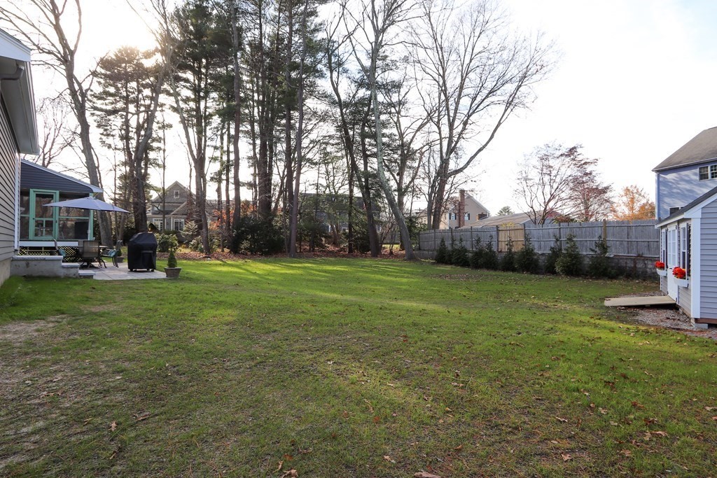 93 Meadowbrook Road Needham, MA 02492 - Photo 28 of 34 a backyard of a house with lots of green space