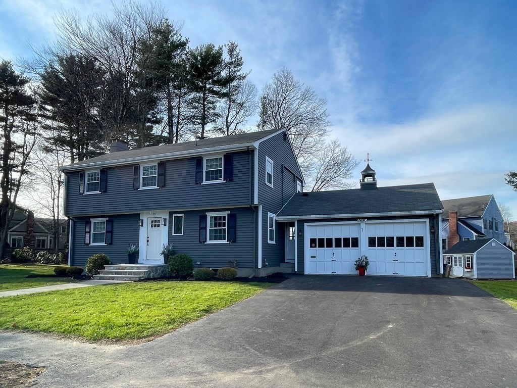 93 Meadowbrook Road Needham, MA 02492 - Photo 30 of 34 a view of a house with a yard and garage