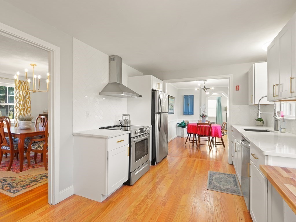 93 Meadowbrook Road Needham, MA 02492 - Photo 6 of 34 a kitchen with stove and refrigerator