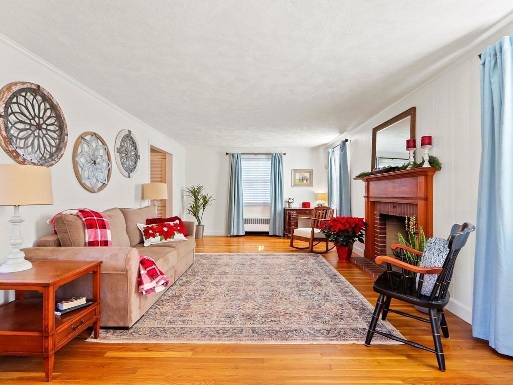 93 Meadowbrook Road Needham, MA 02492 - Photo 9 of 34 a living room with furniture and a fireplace