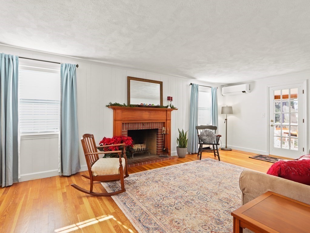 93 Meadowbrook Road Needham, MA 02492 - Photo 10 of 34 a living room with furniture and a fireplace