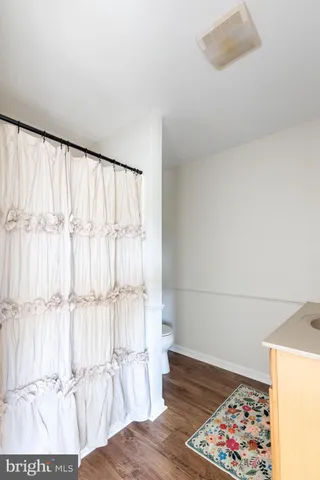 a view of wooden floor in an empty room