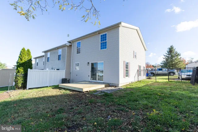a swimming pool with yard and outdoor seating