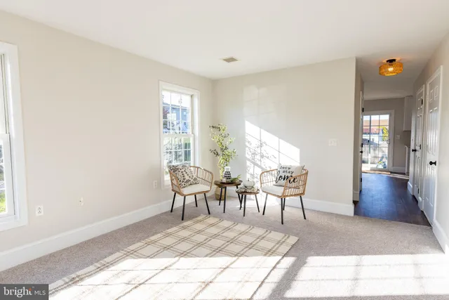 a view of livingroom with furniture wooden floor and windows