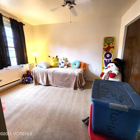 a bed room with a bed and a window